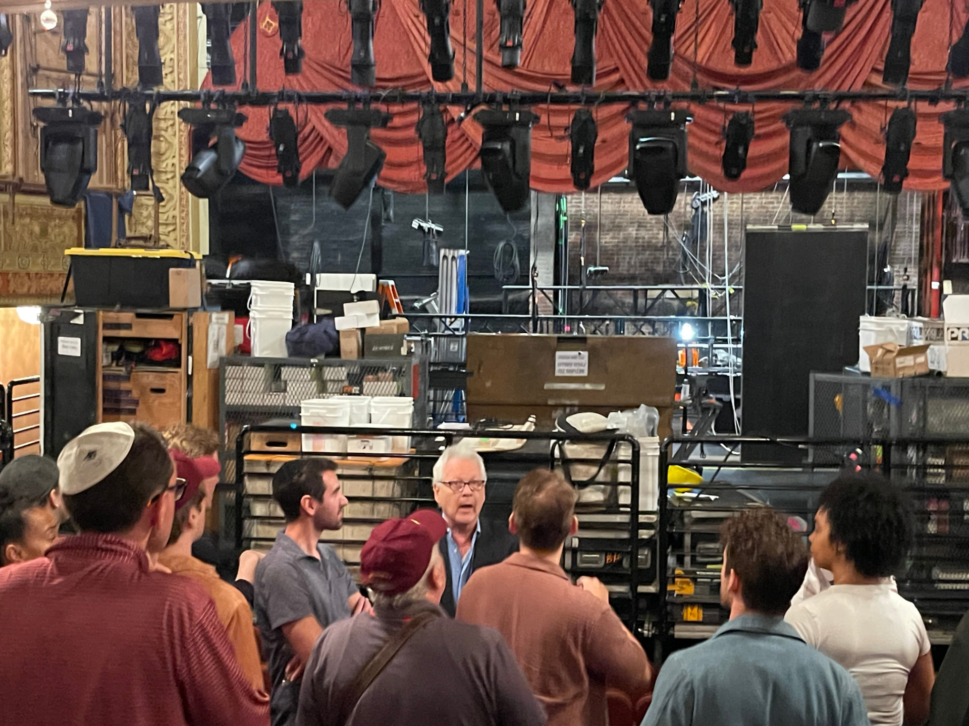 The company gathered onstage as the production moves into the theater
